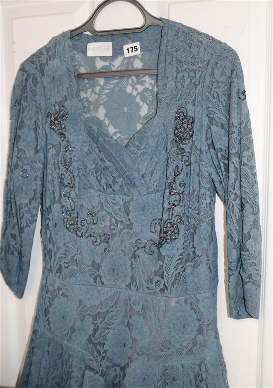 An early 20th century blue lace dress with beaded decoration